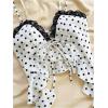 imageOYOANGLE Womens Polka Dots Contrast Lace V Neck Sleeveless Cami Tops Ruffle Trim Tie Front Crop CamisolesBlack and White
