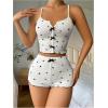 imageOYOANGLE Womens Heart Print Ribbed Knit Cami Pajama Tops Bowknot Criss Cross Camisole Crop Tops NightwearBlack and White
