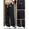 imageOYOANGLE Mens Vintage Elastic Drawstring Waist Jeans Casual Straight Leg Denim PantsBlack